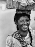 Market Woman Carrying a Basket of Flowers on Her Head