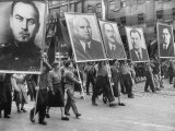 Spectators and Marchers in Prague May Day Parade  Many Carrying Large Pictures of Heroes