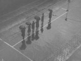 Overhead View of People with Umbrellas Waiting For the Tram  Melbourne  Australia