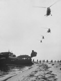 Marines Deplaning from Nose of R3Y2 "Flying LST" on Beach