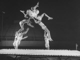 Multiple Exposure Shot of a Gymnast Jumping on a Trampoline