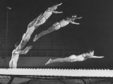 Multiple Exposure Shot of a Gymnast Jumping on a Trampoline
