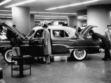 Prospective Buyers Looking over New Dodge Royal at Chrysler Show Room
