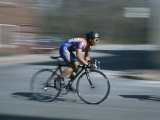 A Bicyclist Speeds Past in a Race