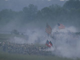 Flags  Soldiers  and Gun Smoke During a Civil War Reenactment