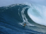 A Surfer Rides a Powerful Wave off the North Shore of Maui Island