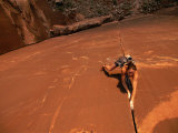 A Young Woman Climbing in Canyonlands National Park