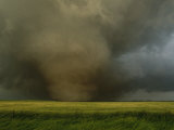 An F4 Category Tornado Travels Across a Field at Great Speed