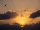 Three US Navy F-185 Jets Silhouetted against the Evening Sky