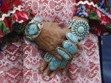Heirloom Rings and Bracelets Lie Thick on the Arms and Hands of a Zuni Woman