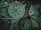 A Close View of Gears and a Drive Chain on a Piece of Machinery