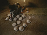 An Egyptian Woman Makes Loaves of Bread in a Traditional Manner