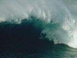 A Surfer Rides a Powerful Wave off the North Shore of Maui Island