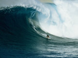 A Surfer Rides a Powerful Wave off the North Shore of Maui Island