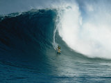 A Surfer Rides a Powerful Wave off the North Shore of Maui Island