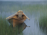 An Adirondack Guide Canoe Floating on Connery Pond at Sunrise