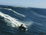 A Surfer and Jet-Skier off the North Shore of Maui Island