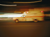 An Ambulance Rushes Past at Night