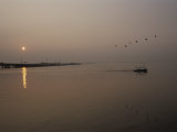 A Fishing Boat Heads out from the Alabama Shore