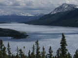 Snow-Capped Moutains Rise Above a Frozen Waterway on Kodiak Island