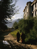 Monks Walk along a Path outside a Monastery
