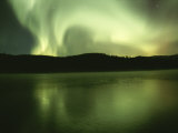 Green and White Streamers of Aurorae Light up the Arctic Sky