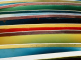 A Close-up of a Stack of Boats Showing Bright Colored Stripes