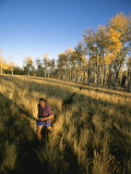A Man Runs Through a Meadow of Tall Grass Near Mt Elden