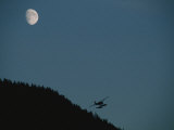 A Float Plane Flies Near a Hill in Ketchikan