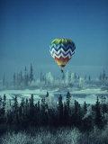 Hot Air Balloon Hovers Over a Snowy Landscape