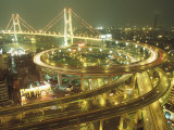 Like a Giant Coiled Snake  a Highway Spirals Down to Meet with Other Roadways