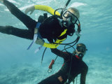 A Diver Teaches a Boy How to Dive