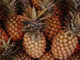 A Group of Pineapples at an Open-Air Fruit Market