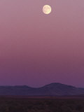 The Moon Shines over the Landscape at Twilight