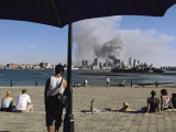 Onlookers Watch Smoke Billowing over Manhattan  September 11  2001
