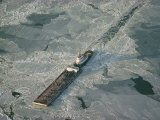 Tugboat Pushing Barge Through Winter Ice on the Chesapeake Bay
