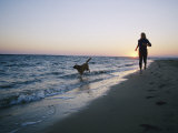 Woman and Dog Running on Beach  Nags Head  North Carolina