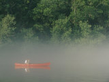 Man Paddling Canoe in Mist  Roanoke River  North Carolina