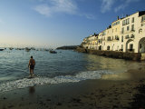 A Beach Goer Wades into the Calm Surf of Cadaques