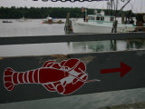 A Lobster Sign Backed by a Lobster Boat on Casco Bay