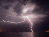 Dramatic Lightning Flashes Over Water