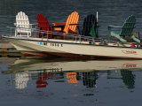 Peaceful Reflections of Colorful Chairs in the Waters of Casco Bay