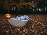 An Illuminated Jack-O-Lantern on the Back of a Rowboat