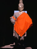 Standing Buddha Statue in Orange Cloth  in Outer Gallery at Angkor Wat  Angkor  Cambodia
