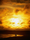 Couple in Silhouette on Beach Beneath Sunset  Isla Santa Cruz  Galapagos  Ecuador