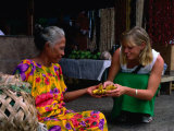 Female Tourist Buying Bananas from Local Woman at Market  Apia  Samoa