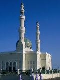Men Walking Past Burami Mosque  Oman