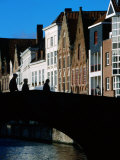 Pedestrians Crossing Canal and Houses Near Jan Van Eyckplein  Bruges  Belgium