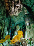 Seated Buddha Statues in Saffron Cloth Inside Cave  Chiang Dao  Thailand