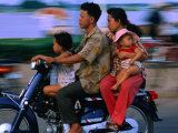 Young Family on Motorcycle  Phnom Penh  Cambodia